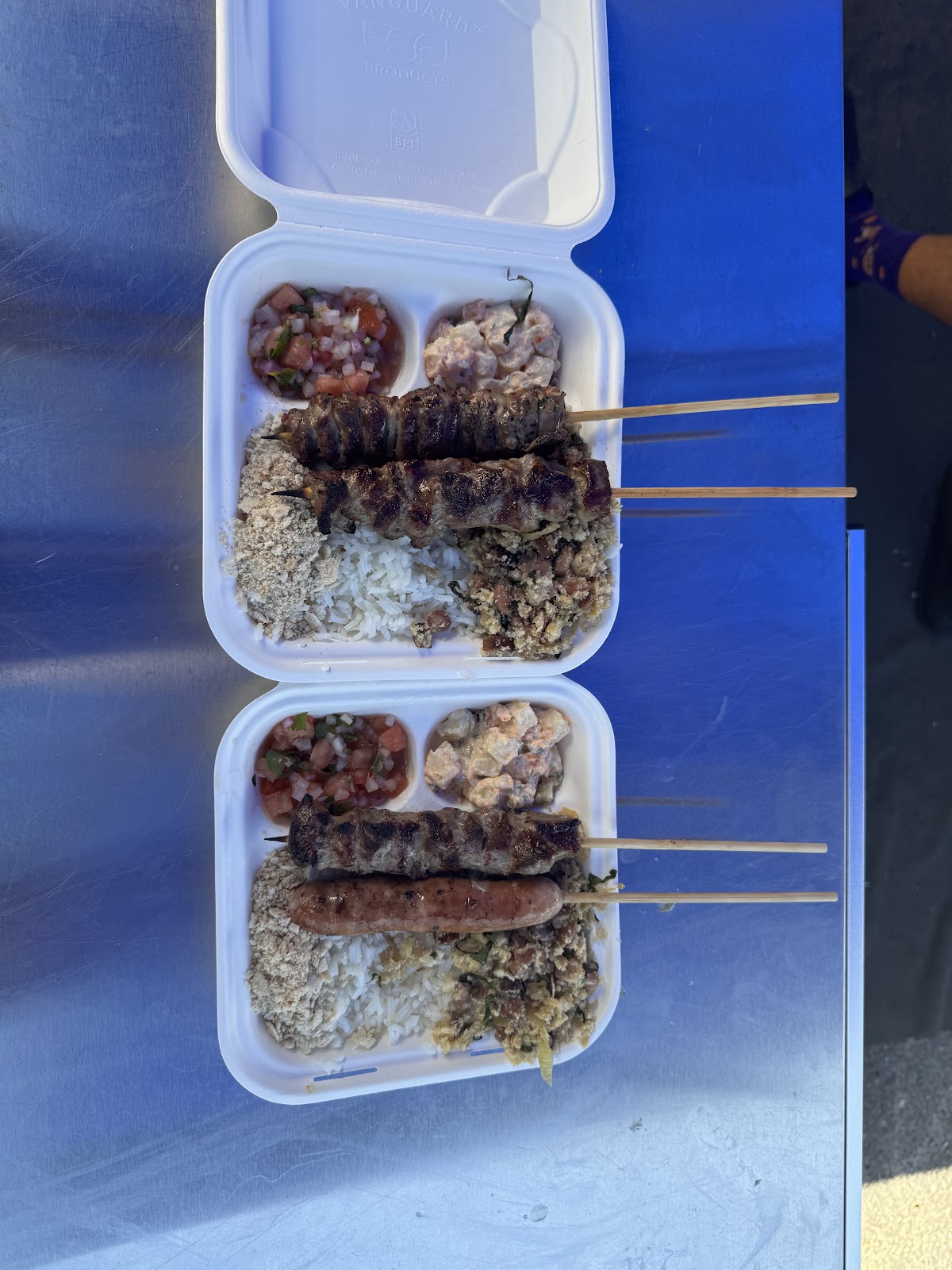 Two full prato feito boxes, three skewers each